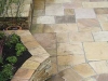 Sandstone Paving with Raised Flower Beds