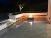 Gas Fire Pit and Built in Seating at Night